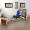 imageStamina Products AeroPilates Pro 565 Pilates Reformer with Oak Wood Base  Studio Grade for Home Use with Cardio Rebounder Adjustable Foot Bar 4 Resistance Springs and Workout DVDPro XP 557