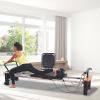 imageStamina Products AeroPilates Pro 565 Pilates Reformer with Oak Wood Base  Studio Grade for Home Use with Cardio Rebounder Adjustable Foot Bar 4 Resistance Springs and Workout DVDPro Series 565